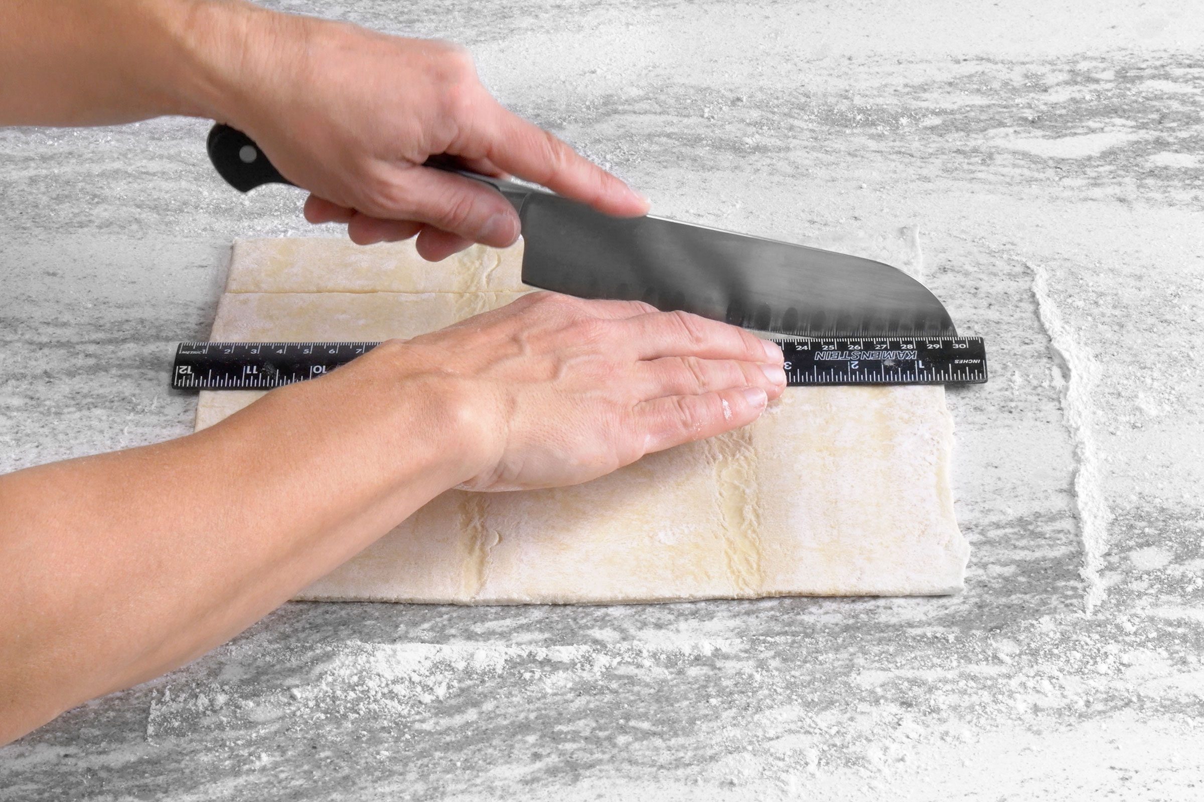 Cutting the pastry dough sheet using a sharp knife