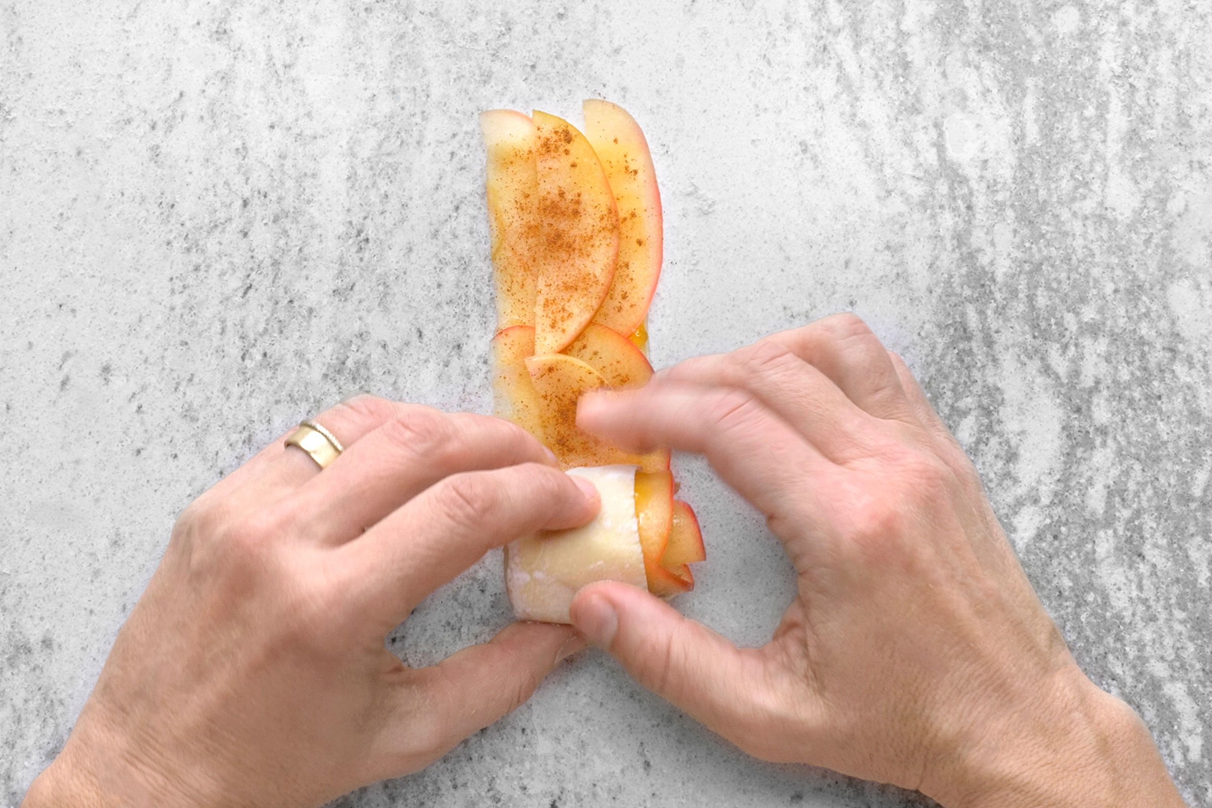 Puff pastry with apple slices rolled up into a rose shape