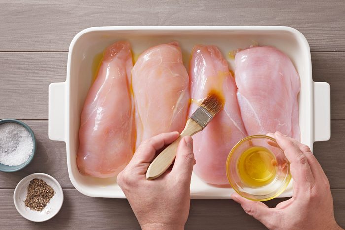 Chicken Breasts on greased sheet pan and brushed with olive oil