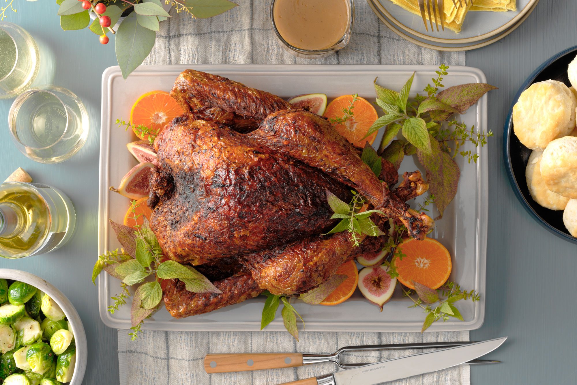 Deep Fried Turkey on a plate, accompanied by a knife and fork, ready for a festive meal