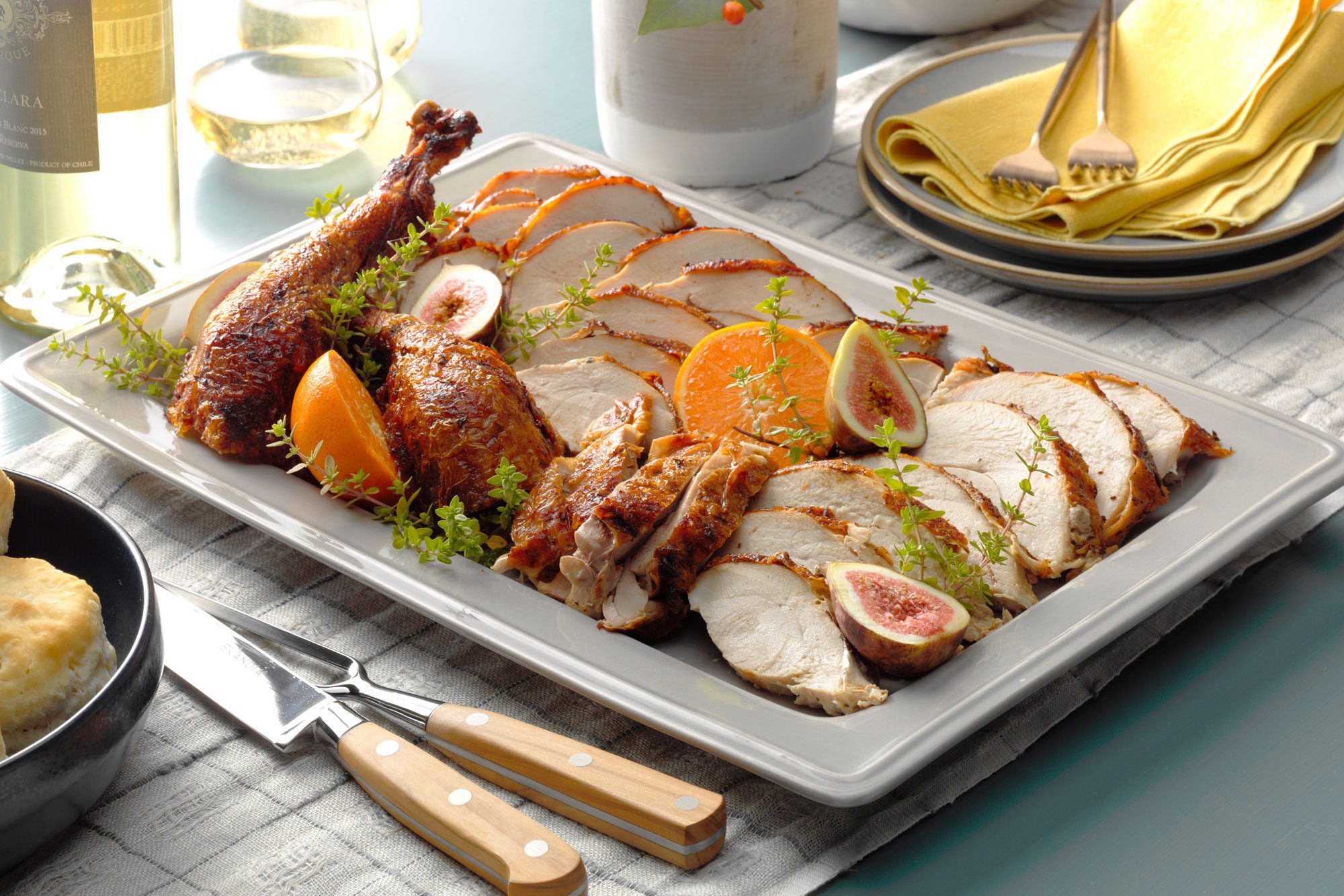 Deep Fried Turkey on slices on a plate, accompanied by a knife and fork, ready for a festive meal