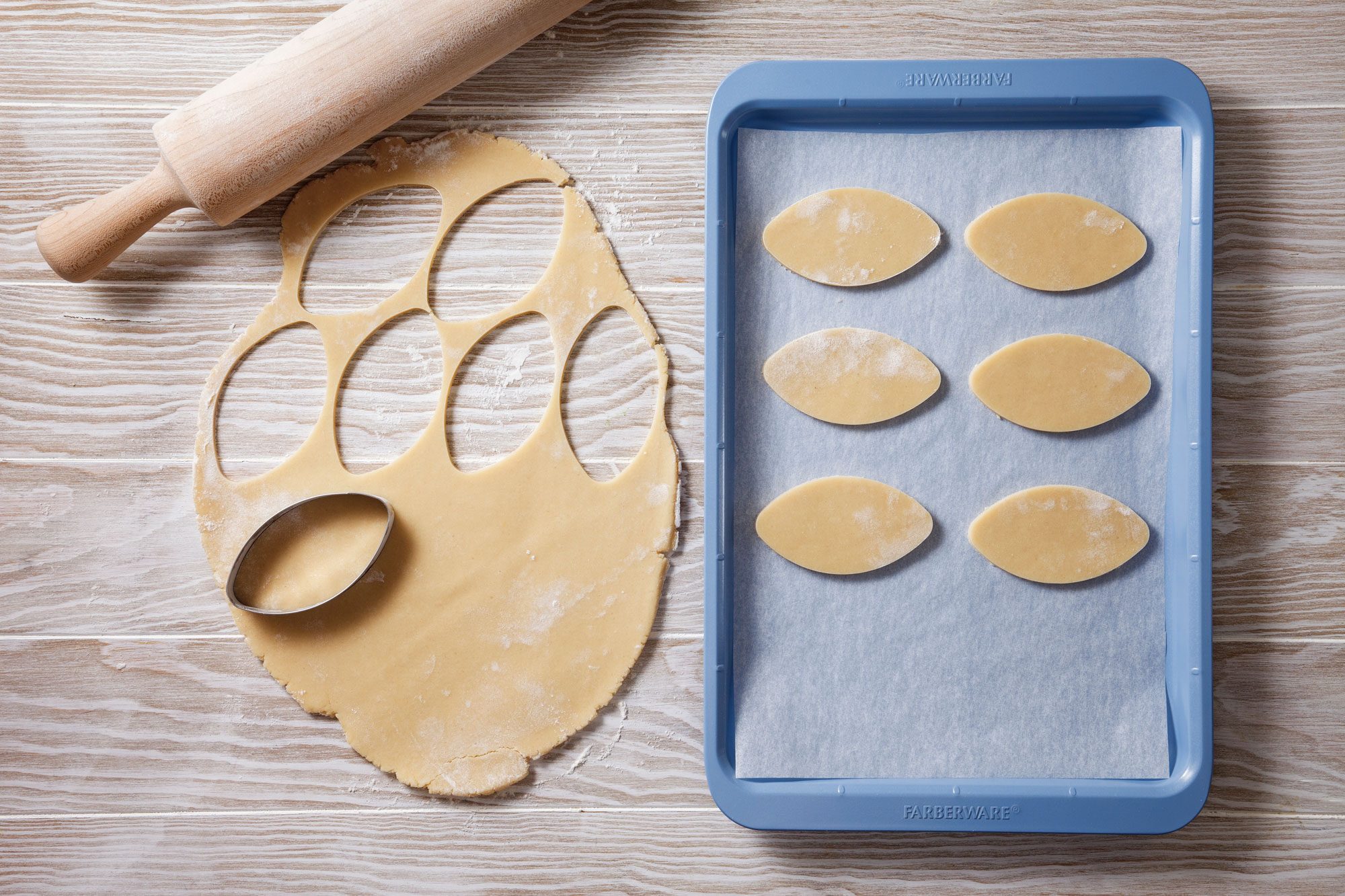 Roll dough and Cut with a football-shaped cookie cutter.