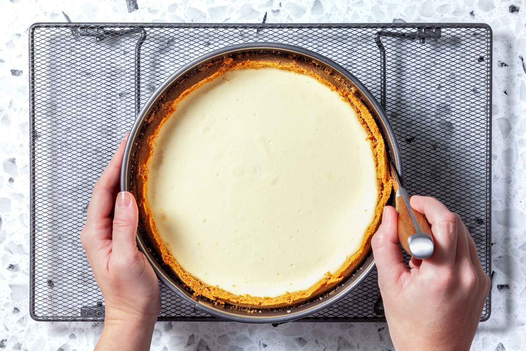 lessening sides of cheesecake with knife