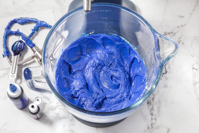 Beat in food colorings until evenly incorporated.