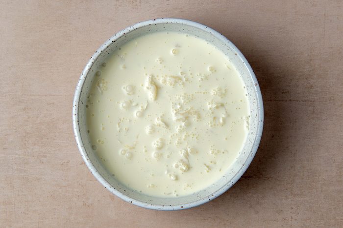 mozarella curd with water in a bowl