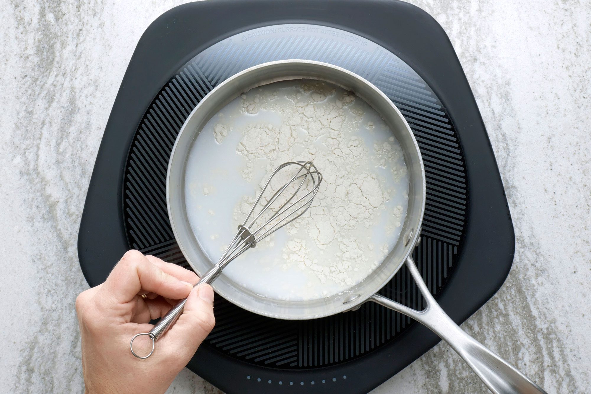 Place the 3 tablespoons water, 3 tablespoons whole milk and 2 tablespoons bread flour in a small pan