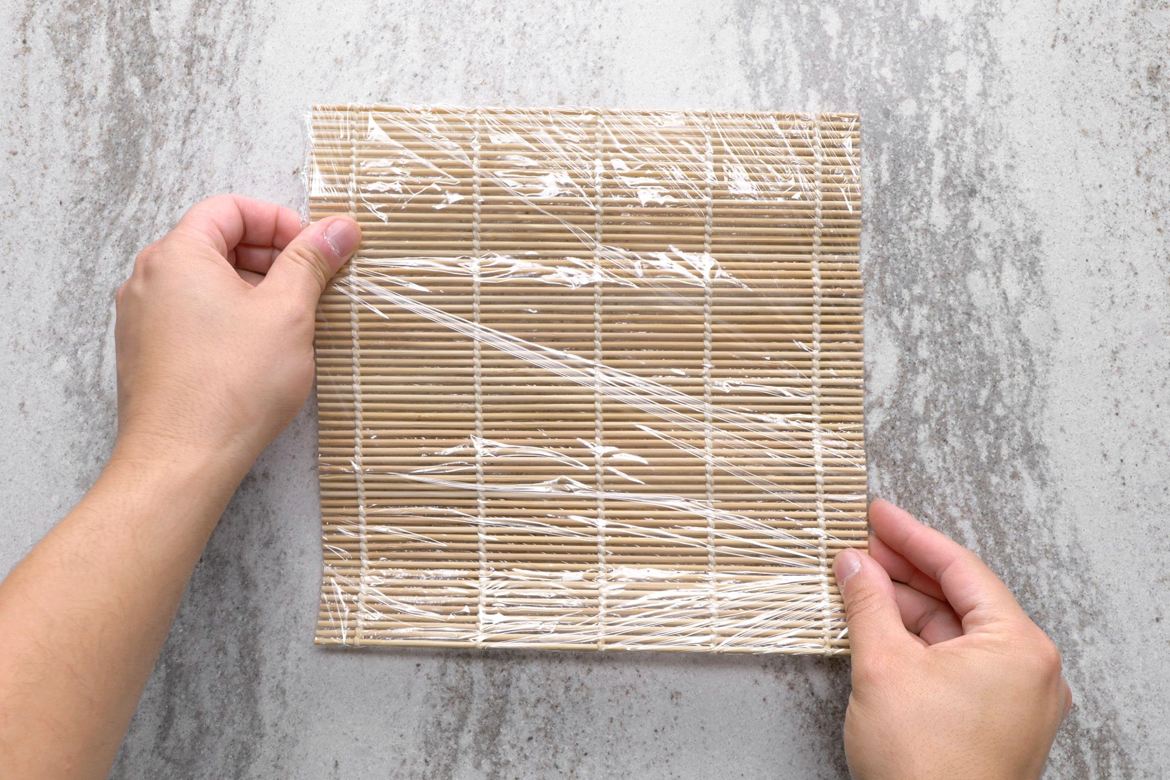 Sushi mat wrapped in plastic wrap