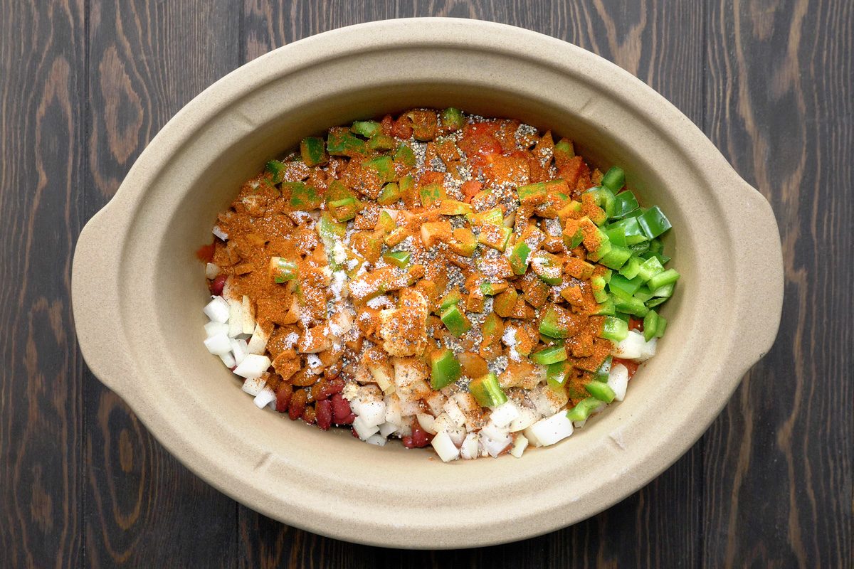 beans, diced tomatoes, tomato sauce, onions, green pepper, garlic, chili powder, salt and pepper added to beef