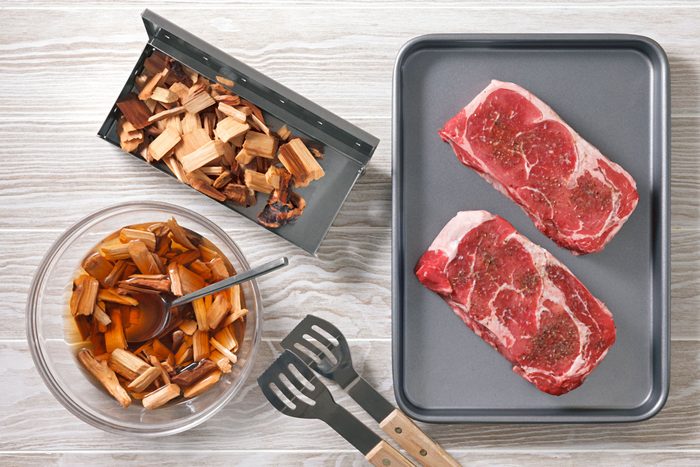 wood chips next to seasoned steak