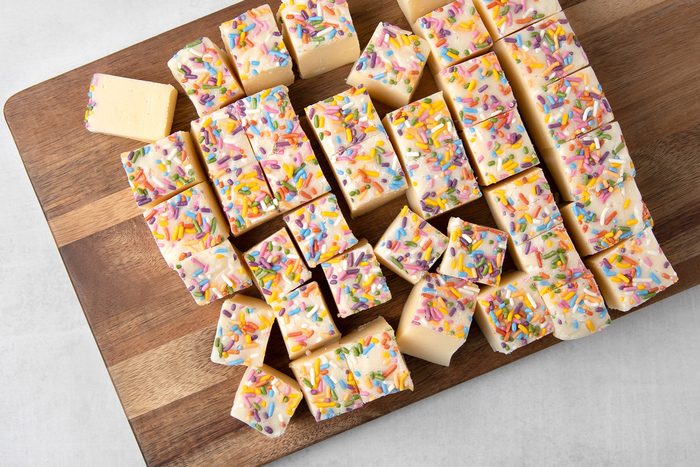 fudge cut in square pieces on chopping board