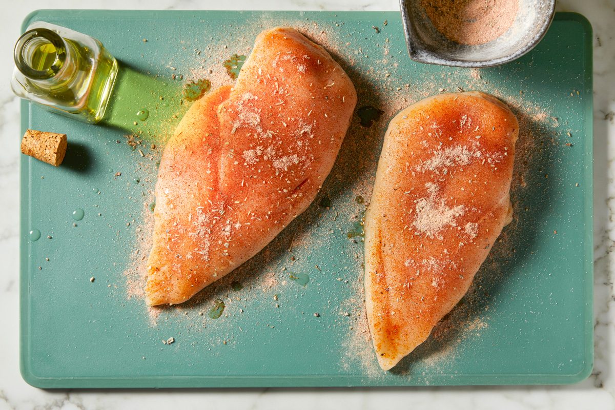 Drizzle chicken breasts with olive oil. Season with herb and spice rub on all sides.