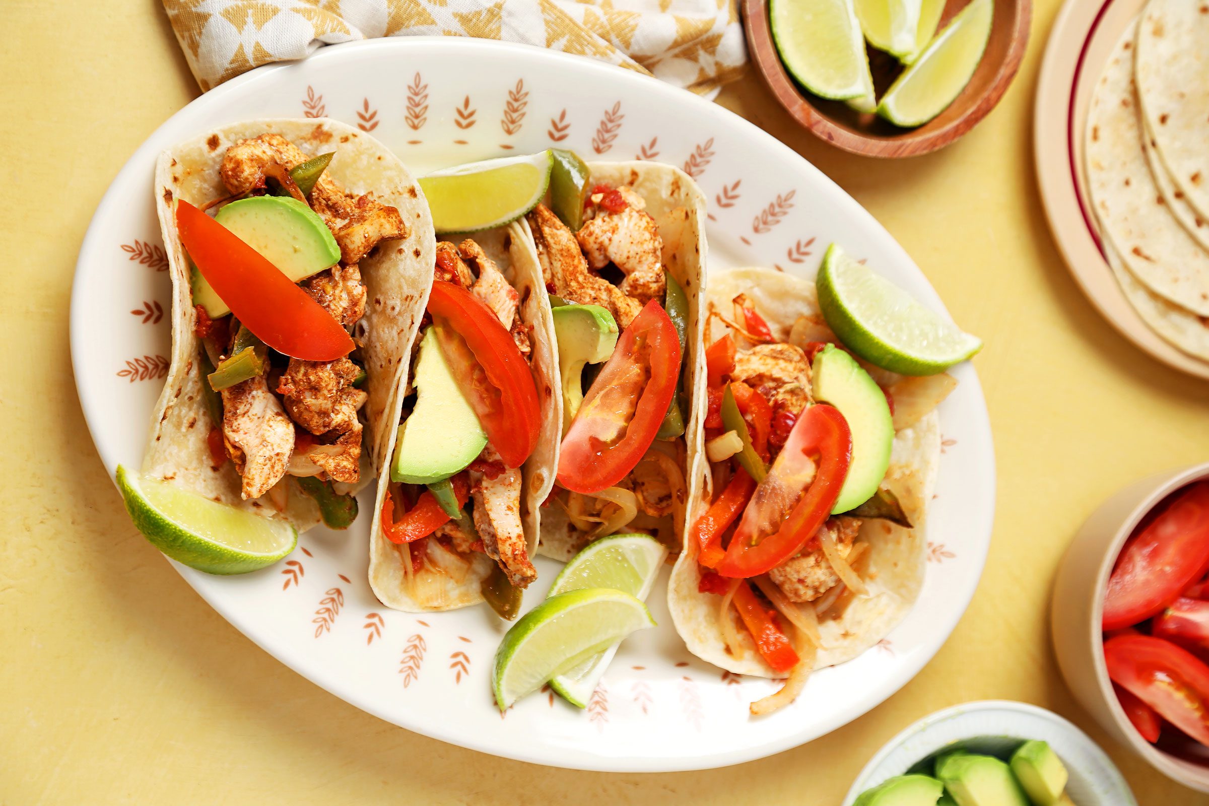 Baked Chicken Fajitas served on a plate with veggies on side