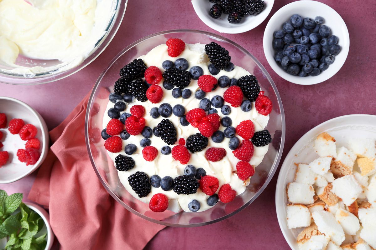 pudding mixture and whipped topping layers topped with berries