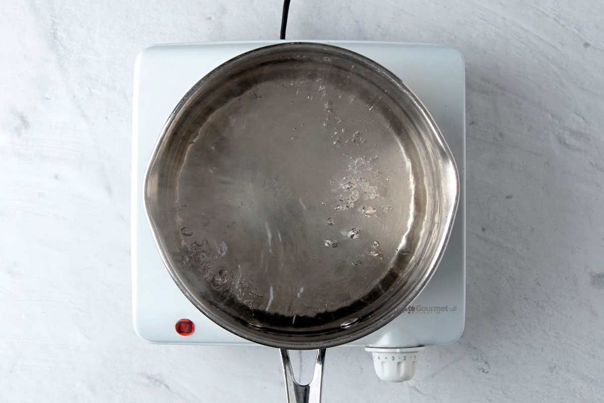 overhead shot of water boiling in a pan