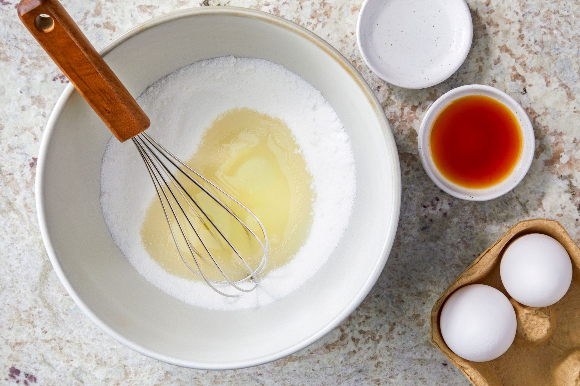 Beat sugar and oil until blended; Beat in eggs; then extracts; whisk tool