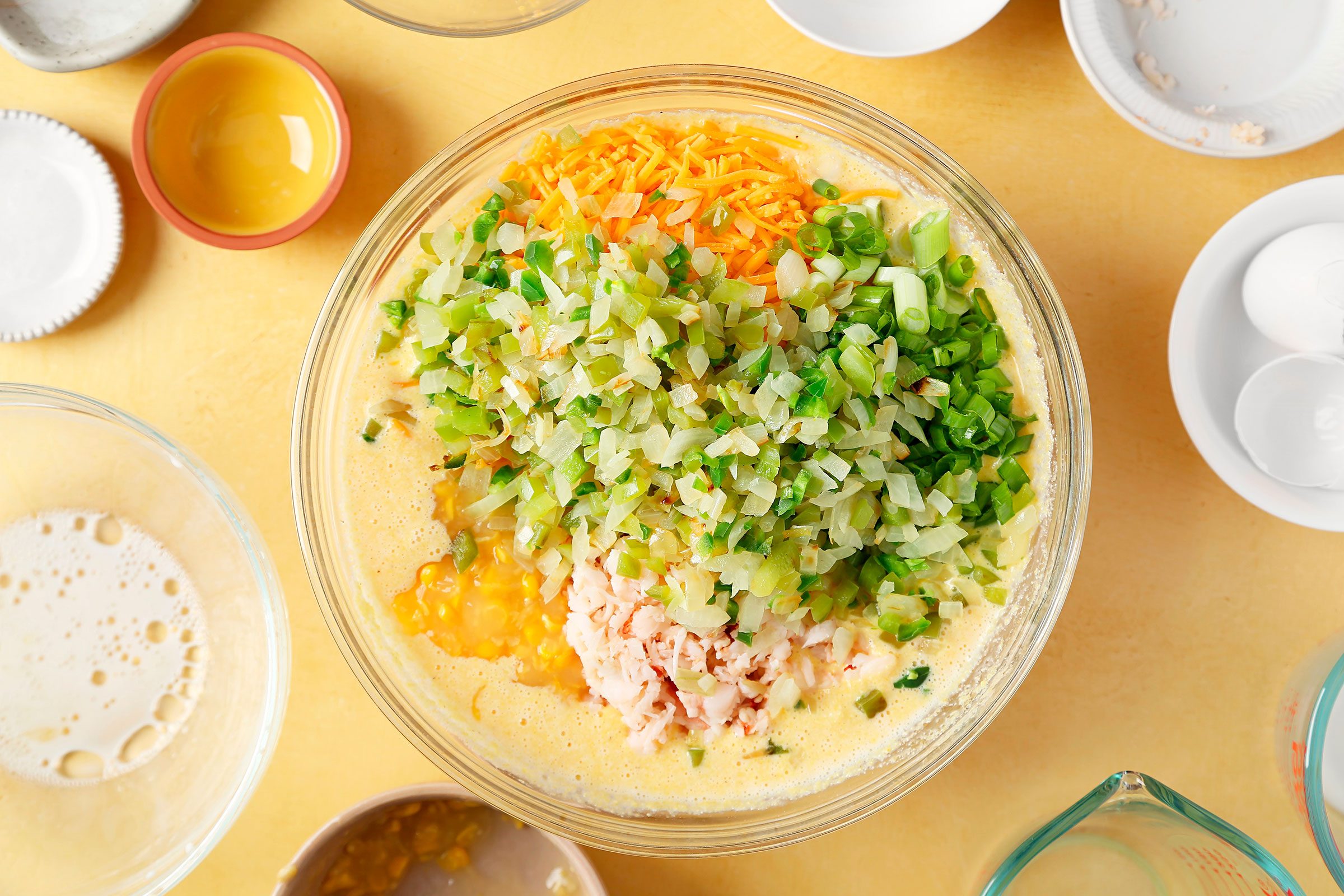 Corn, cheese, onions, crawfish and jalapeños in cornmeal mixture