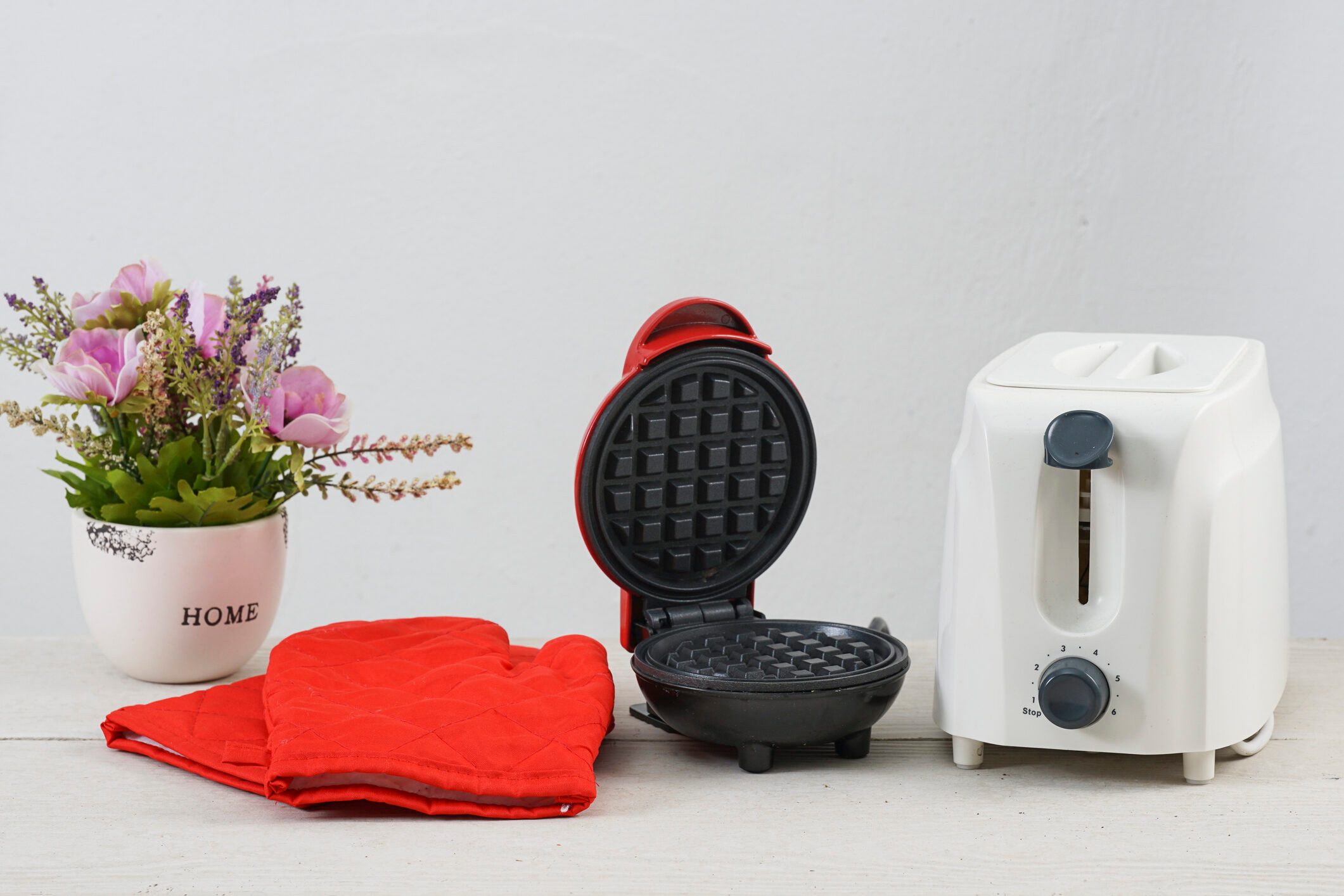 toaster and red glove baker