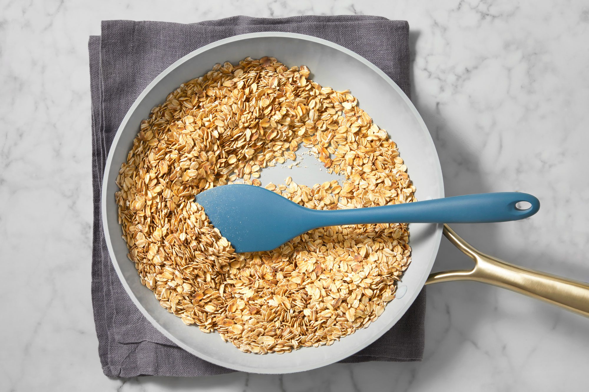 In a large nonstick skillet, toast oats over medium heat until golden brown.