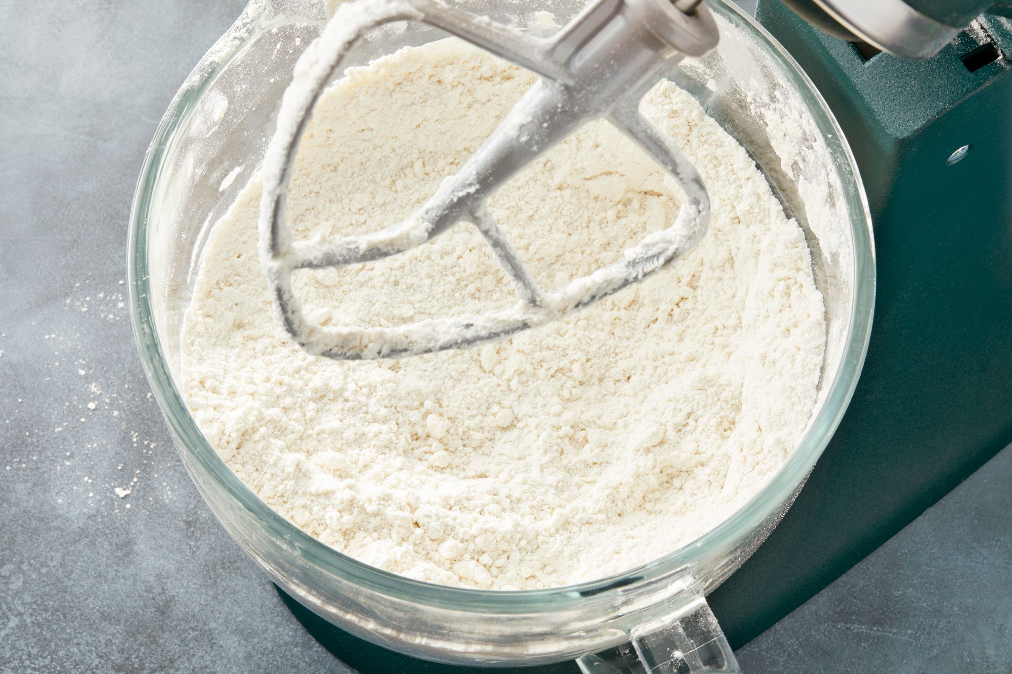 on low speed gradually beat in shortening and extracts until mixture resembles fine crumbs