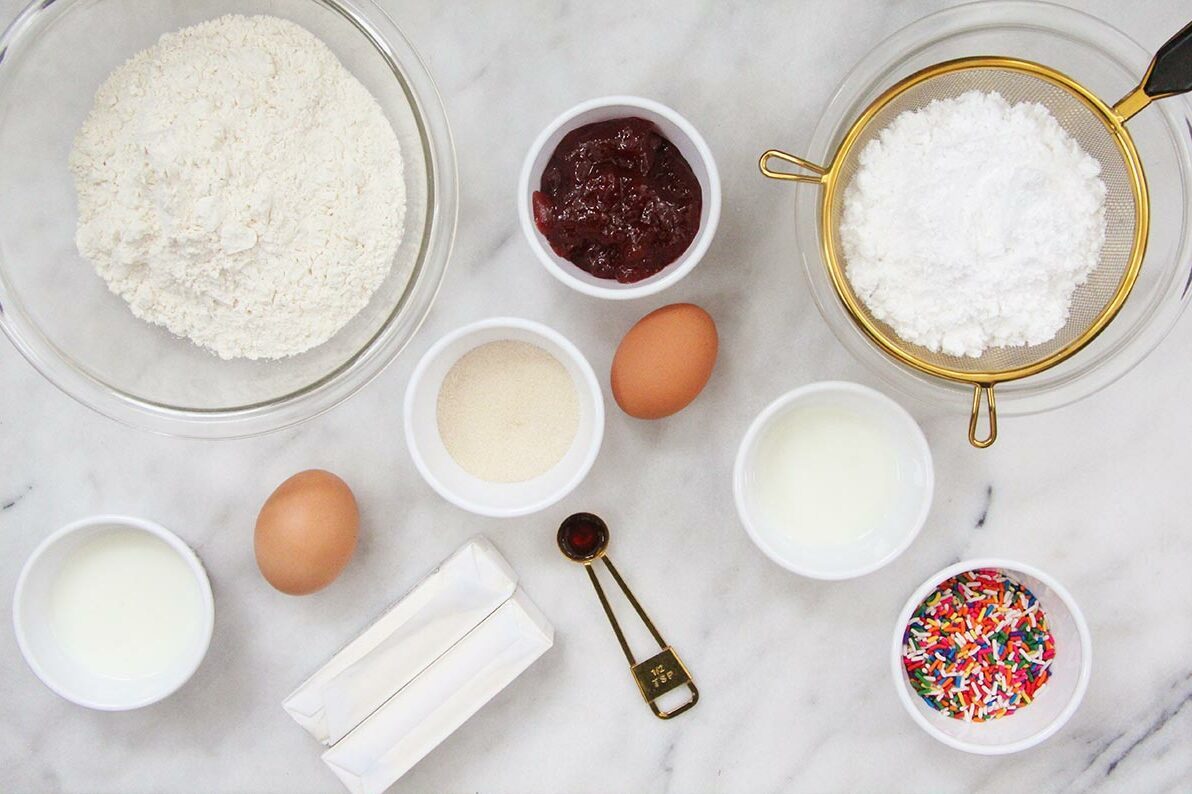 Ingredients in various bowls and measuring cups on a white countertop