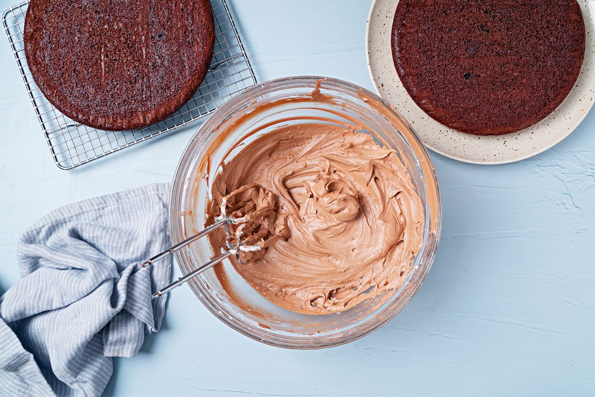 Vegan chocolate frosting whipped in a large bowl.