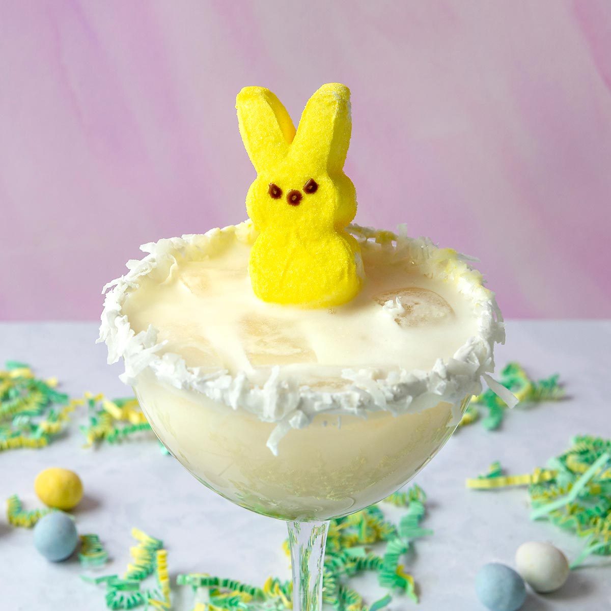 An Easter Peep placed on top of a milkshake.