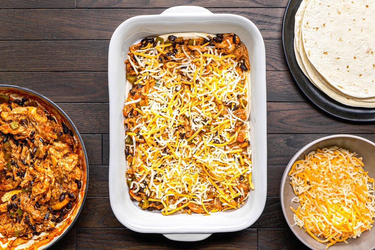 chicken filling, shredded Mexican blend cheese and tortillas layered in a baking dish