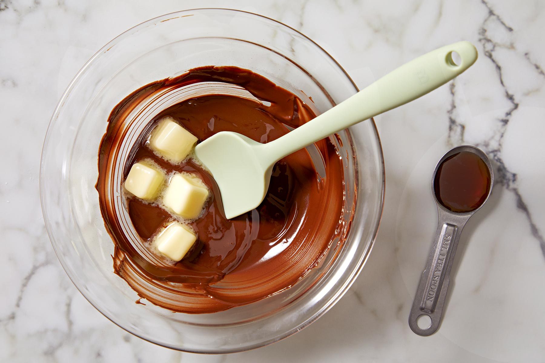 Melt chocolate and butter in a glass bowl with the help of a spatula.