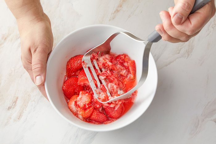 Mash strawberries; set aside.
