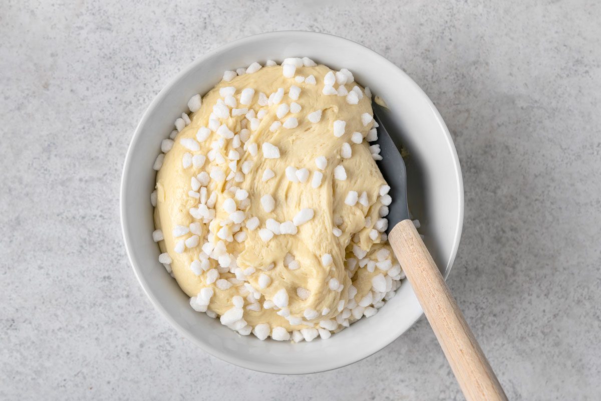 overhead shot of dough mixed with belgian pearl sugar