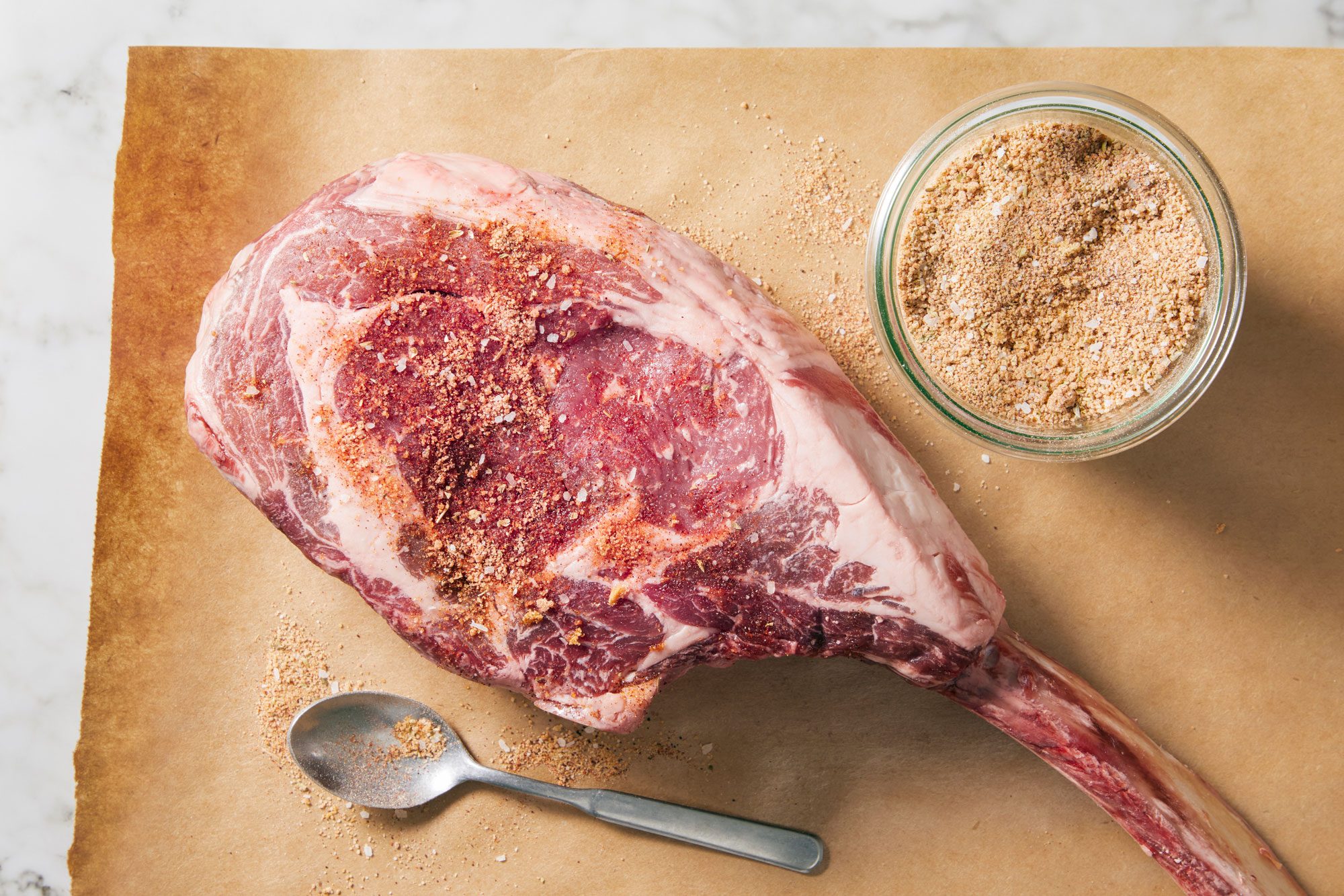 Raw steak seasoned with dry rub