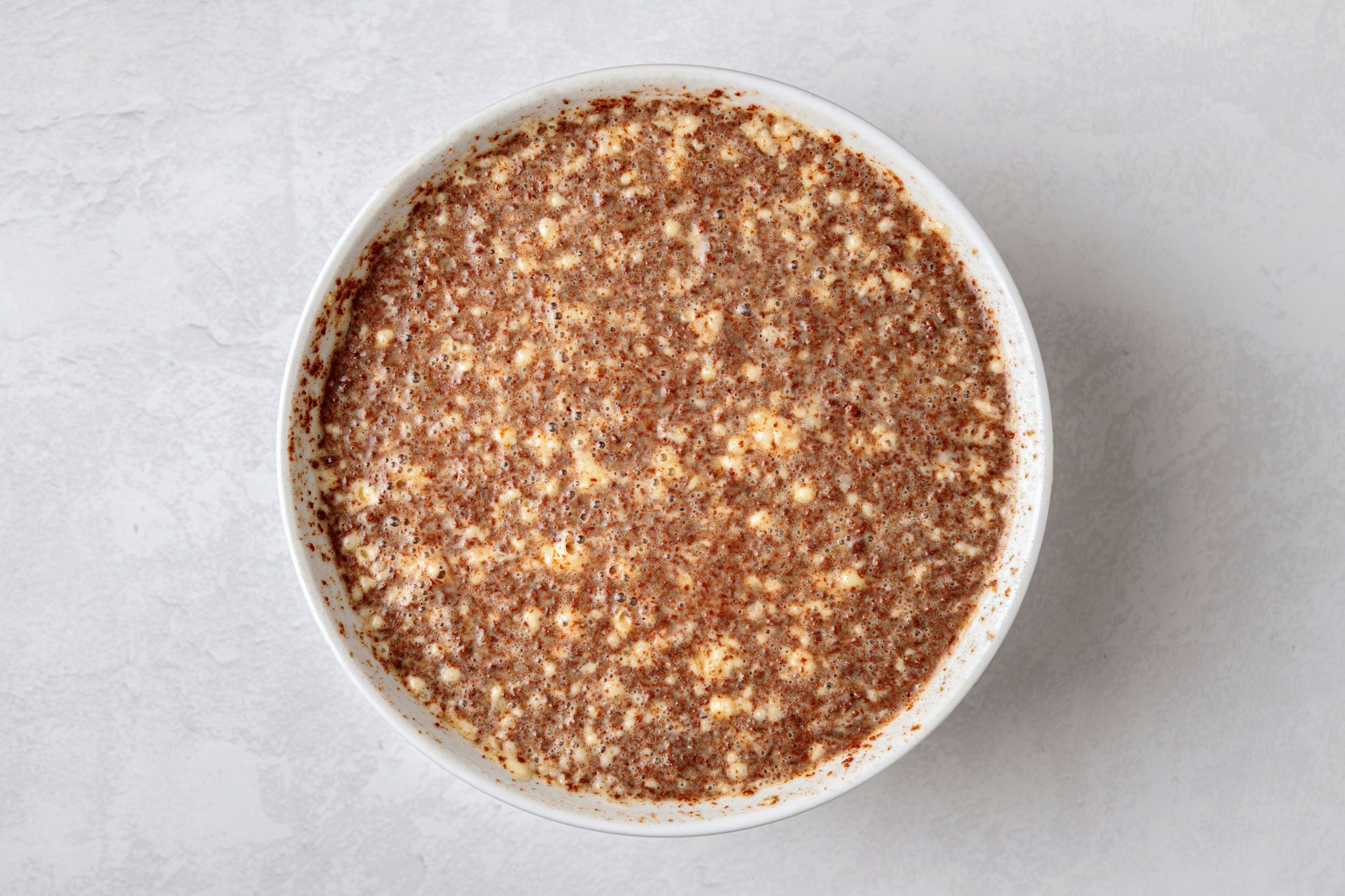 In a microwave melt butter and chocolate and in a large bowl whisk the eggs; milk; vanilla and cooled chocolate mixture