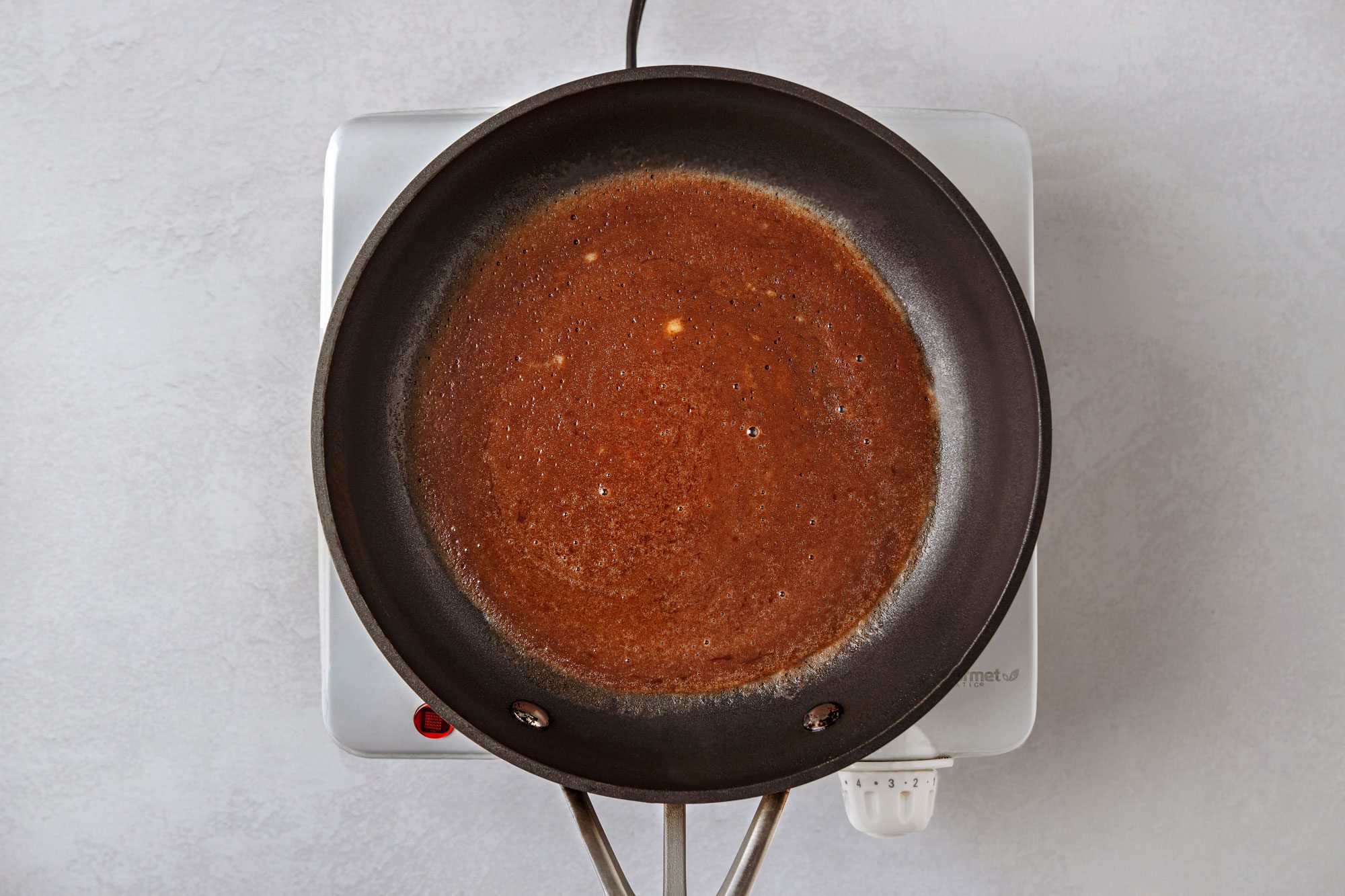Pour 2 tablespoons crepe batter into center of skillet