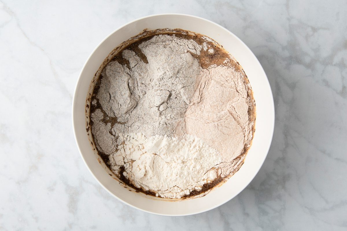 brown sugar, molasses, caraway seeds, oil, salt added to yeast dissolved ins arm water