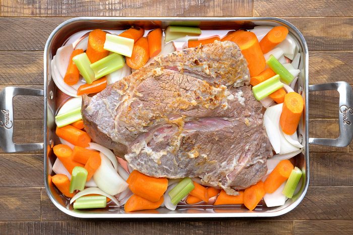 Transfer to a small roasting pan. Add the onion, carrots, celery and reserved marinade.