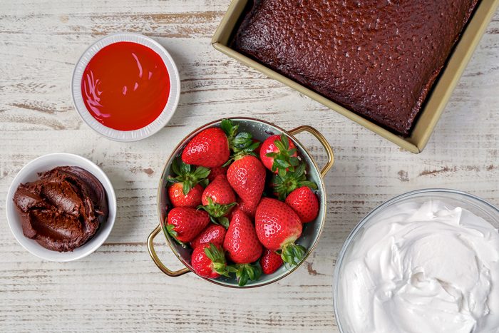 chocolate cake mix, strawberries, strawberry glaze, whipped topping, chocolate frosting and chocolate shavings