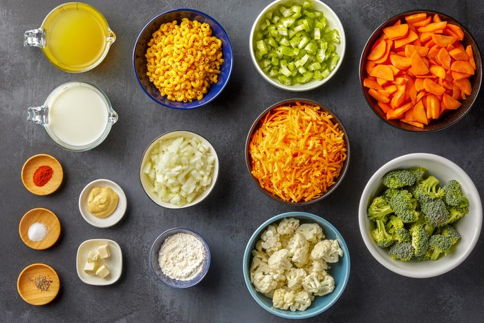 Cauliflower, carrots, celery, butter, broccoli, macaroni, onion, flour, milk, mustard, chicken broth, cheddar cheese and seasonings