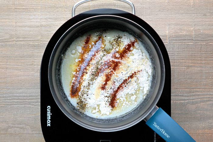 flour, onion powder, chipotle powder, salt and pepper added to melted butter in a large saucepan