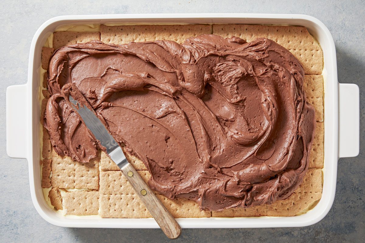 Spread chocolate frosting over top.