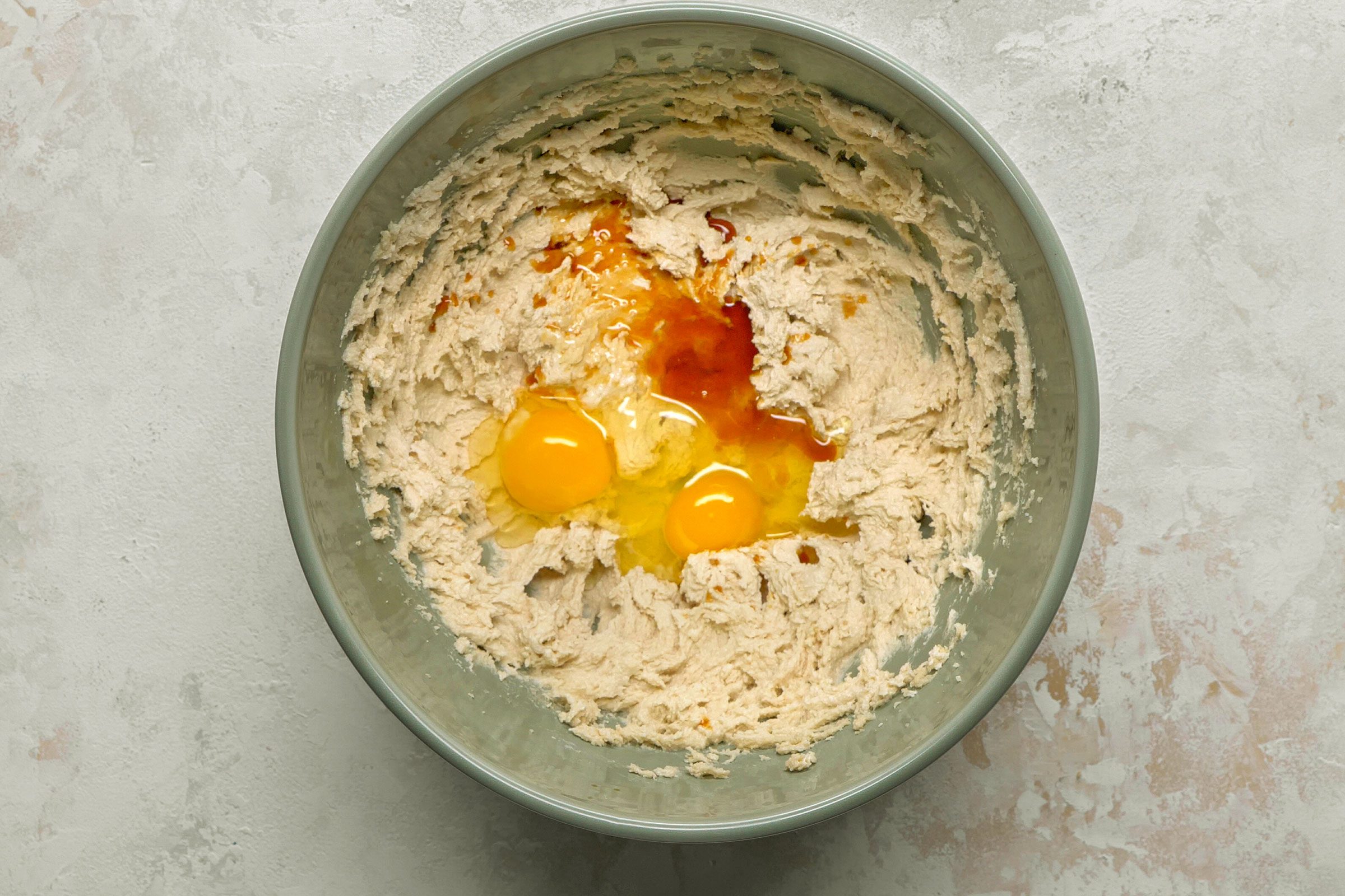 Eggs and vanilla extract beaten into egg and sugar mixture