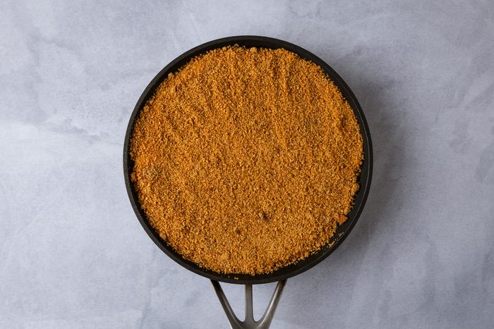 Add cracker crumbs and cinnamon; cook