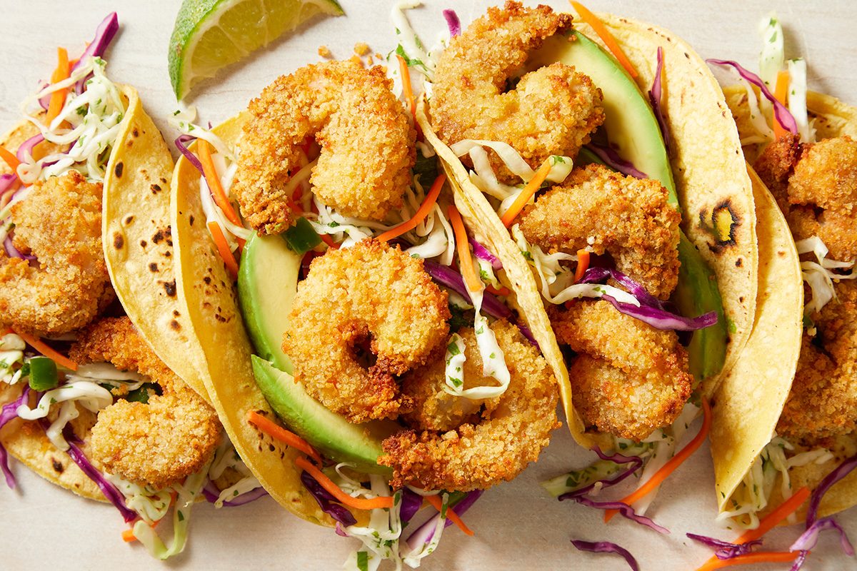 Overhead shot of Popcorn Shrimp Tacos with Cabbage Slaw
