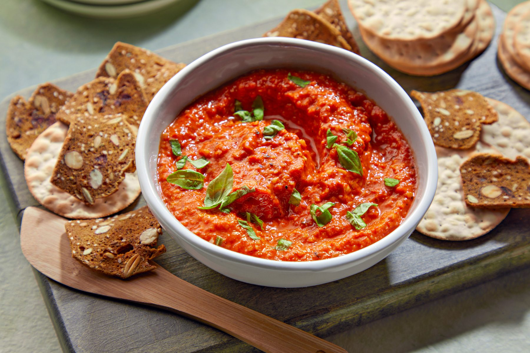 3/4th shot of Red Pepper Tapenade served with crackers