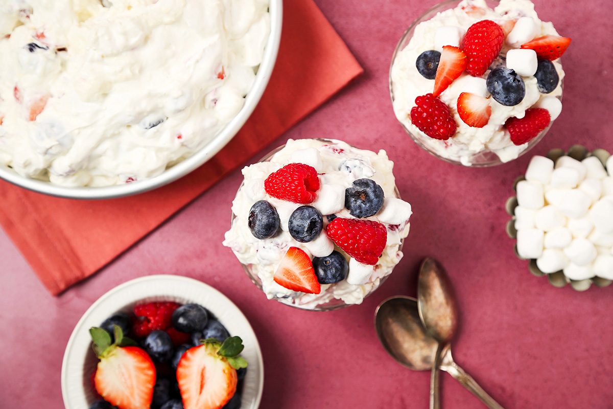 Red, White, and Blue Cheesecake Salad in bowls