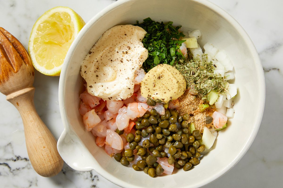 Overhead shot of a small bowl; combine the first 11 ingredients; on marble surface;