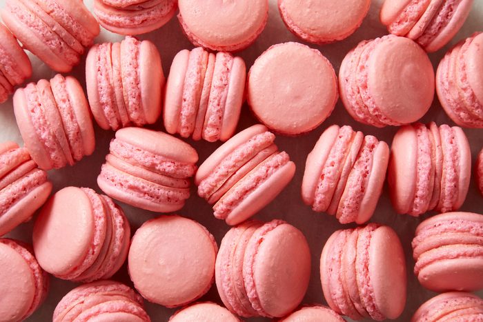 Top view shot of Strawberry Macarons; placed over wax sheet