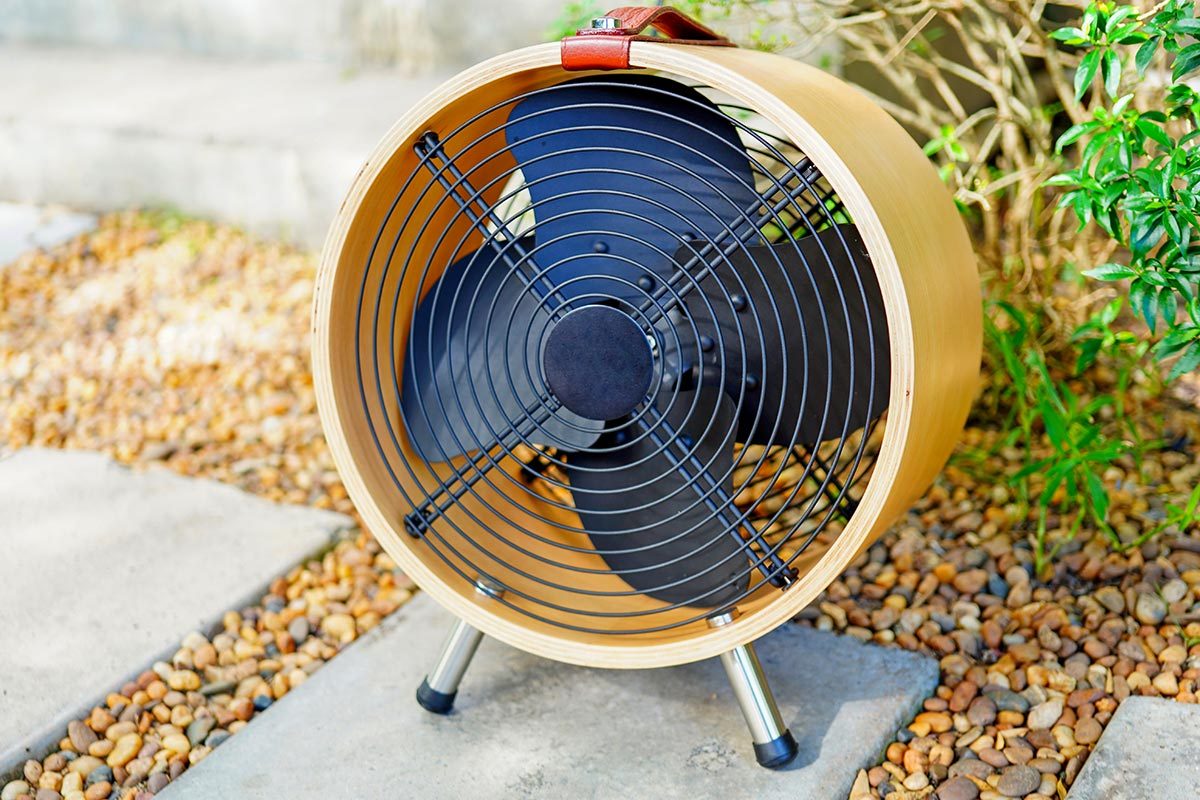 Small fan install for working outdoors in garden during Summer and hot weather 