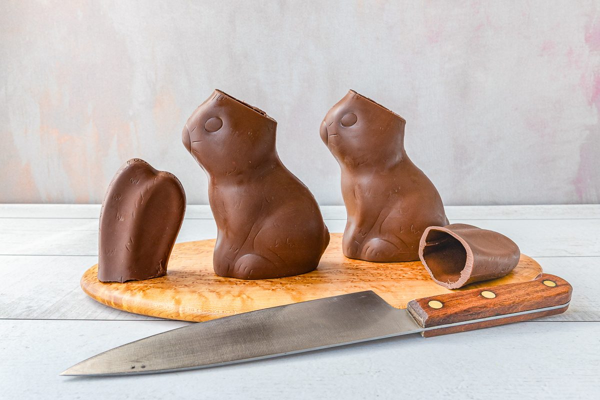 knife in front of chocolate bunnies with ears cut off