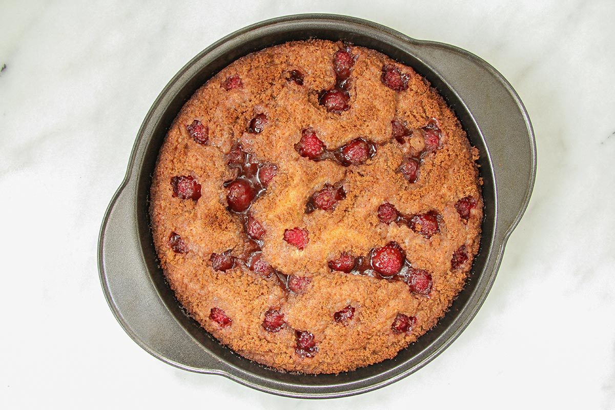 Baked raspberry Riches Cake on atble for cool down