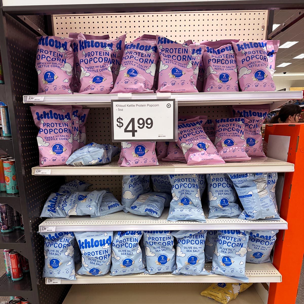 Packages of Khloud Popcorn on a shelf at Target